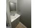 Updated bathroom features a stylish vanity with gray cabinetry and chrome fixtures at 237 Country Club Dr, Jonesboro, GA 30238