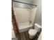 Standard bathroom with a shower-tub combo, toilet, and gray-painted walls at 237 Country Club Dr, Jonesboro, GA 30238