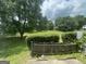 Well maintained grassy area with mature trees and partial fencing at 237 Country Club Dr, Jonesboro, GA 30238