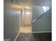Inviting entrance with tile flooring and natural light, with carpeted staircase at 237 Country Club Dr, Jonesboro, GA 30238
