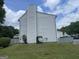 View of the exterior featuring vinyl siding, chimney, and satellite dish at 237 Country Club Dr, Jonesboro, GA 30238