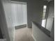 Bright hallway with carpet and natural light through large windows at 237 Country Club Dr, Jonesboro, GA 30238
