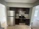 Well-lit kitchen with updated appliances, countertops and ample cabinet space at 237 Country Club Dr, Jonesboro, GA 30238