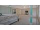 Bedroom with view of office, TV, and neutral colored walls at 6697 Princeton Park Walk, Lithonia, GA 30058