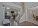 Inviting foyer with hardwood floors, a staircase, and views into the living room at 6697 Princeton Park Walk, Lithonia, GA 30058