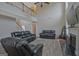Bright living room with high ceilings, a fireplace, and comfortable seating for relaxing at 6697 Princeton Park Walk, Lithonia, GA 30058