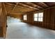 Unfinished basement with exposed framing, windows, and concrete flooring ready for customization at 8045 Coleson Xing, Locust Grove, GA 30248