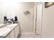 Bathroom boasts double sinks with vanity and a large mirror over the vanity area at 8045 Coleson Xing, Locust Grove, GA 30248