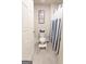 Bathroom showcasing a toilet with blue and white decor and a shower with a blue and white curtain at 8045 Coleson Xing, Locust Grove, GA 30248