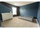 Bedroom features modern furnishings, a crib, a changing table, and neutral-toned walls at 8045 Coleson Xing, Locust Grove, GA 30248
