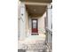 Inviting front porch with a charming welcome sign, brick steps, and a decorative wreath on the front door at 8045 Coleson Xing, Locust Grove, GA 30248