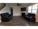 Comfortable living room features a ceiling fan, fireplace and comfortable seating at 8045 Coleson Xing, Locust Grove, GA 30248