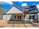A model home featuring a covered patio space and large backyard at 323 Nicole Dr, Temple, GA 30179