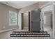 A model home bedroom features a closet and neutral colored walls at 323 Nicole Dr, Temple, GA 30179