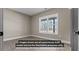 A model bedroom featuring hard surface floors, fresh paint, and a new window at 323 Nicole Dr, Temple, GA 30179