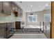 A model home featuring an open kitchen with light countertops and modern cabinetry at 323 Nicole Dr, Temple, GA 30179