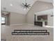 Bright living room with vaulted ceilings, a modern fan, and an eat-in bar to the kitchen at 323 Nicole Dr, Temple, GA 30179