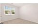Cozy bedroom with large window offering bright, natural light at 346 Friendship Oak Way, Hampton, GA 30228