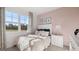 Cozy bedroom with large windows, offering plenty of natural light and serene outdoor views at 346 Friendship Oak Way, Hampton, GA 30228