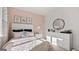 A light and airy bedroom with a window view, complemented by chic decor and great light at 346 Friendship Oak Way, Hampton, GA 30228