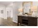 Welcoming hallway with hardwood floors, decoratively furnished with table lamps, a mirror, and tasteful decorations at 346 Friendship Oak Way, Hampton, GA 30228