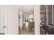 Inviting hallway with wood flooring and modern decor leads through the home at 346 Friendship Oak Way, Hampton, GA 30228