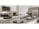Modern kitchen featuring stainless steel appliances, granite countertops, and a stylish breakfast bar at 346 Friendship Oak Way, Hampton, GA 30228