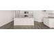 Contemporary kitchen features stainless appliances, granite countertops, and an island with sink at 346 Friendship Oak Way, Hampton, GA 30228