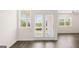 Bright living room with sliding glass door and window at 346 Friendship Oak Way, Hampton, GA 30228