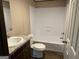 Clean bathroom showcasing a vanity with stone countertop and a shower-tub combo at 30 Alyssa Ln, Bowdon, GA 30108