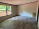 Inviting bedroom with abundant natural light, wood-look floors, and serene views outside at 30 Alyssa Ln, Bowdon, GA 30108