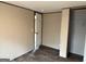 Bedroom features hardwood floors, a closet, and a white paneled door at 30 Alyssa Ln, Bowdon, GA 30108