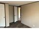 Bedroom features hardwood floors and a doorway to another room at 30 Alyssa Ln, Bowdon, GA 30108