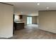Bright and airy kitchen with wood cabinets, an island, and sliding glass doors at 30 Alyssa Ln, Bowdon, GA 30108