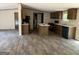 Full kitchen view with modern appliances, granite countertops, and a kitchen island with wood-look flooring at 30 Alyssa Ln, Bowdon, GA 30108