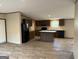 Open kitchen featuring an island, dark wood cabinets, and modern appliances at 30 Alyssa Ln, Bowdon, GA 30108