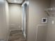 Functional laundry room equipped with utility connections, storage and shelving for efficient organization at 30 Alyssa Ln, Bowdon, GA 30108