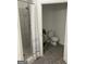 Bathroom featuring tiled shower and toilet with tiled floors at 3108 Westchester Ne Rdg, Atlanta, GA 30329