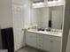 Bathroom with double sink vanity, large mirror and modern lighting at 3108 Westchester Ne Rdg, Atlanta, GA 30329