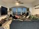Comfortable living room with cozy seating, large windows, stylish decor, and a ceiling fan at 3108 Westchester Ne Rdg, Atlanta, GA 30329