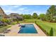 Aerial view of a backyard pool, patio, and lush landscaping offer an inviting outdoor space at 770 Tralee Dr, Fayetteville, GA 30215