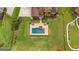 Overhead view of a backyard pool, patio, and landscaped yard, offering a private outdoor oasis at 770 Tralee Dr, Fayetteville, GA 30215