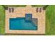 An overhead view of a pool and patio area with outdoor seating and a landscaped yard at 770 Tralee Dr, Fayetteville, GA 30215