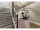 Staircase landing revealing a basement gym with exercise equipment, and durable flooring at 770 Tralee Dr, Fayetteville, GA 30215