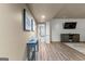 Basement hallway with a blue accent table and coastal artwork leading to an entertainment area at 770 Tralee Dr, Fayetteville, GA 30215