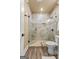Updated bathroom with walk-in shower, tile surround, and seamless glass enclosure at 770 Tralee Dr, Fayetteville, GA 30215