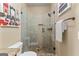 Bathroom features a glass-enclosed shower with tiled walls and floor, offering a luxurious bathing experience at 770 Tralee Dr, Fayetteville, GA 30215