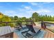 Deck with outdoor lounge chairs overlooking a pool and manicured backyard at 770 Tralee Dr, Fayetteville, GA 30215