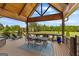 Outdoor deck with table, chairs, and a peaceful view of trees and the backyard at 770 Tralee Dr, Fayetteville, GA 30215