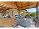 Deck with outdoor table, chairs, and a blue grill and view of the backyard at 770 Tralee Dr, Fayetteville, GA 30215